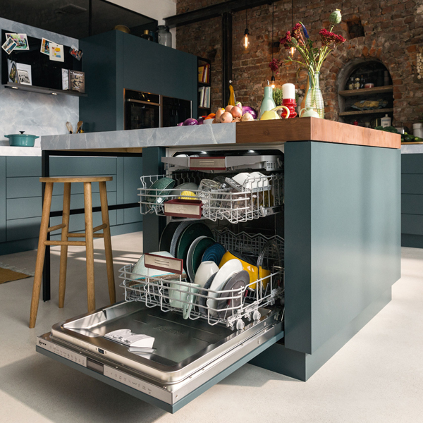 open dishwasher built into table for ease of access