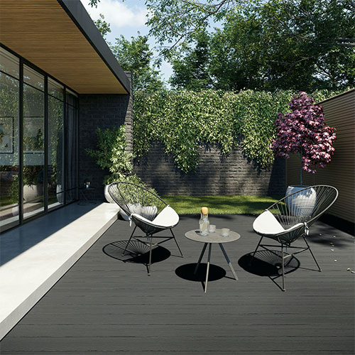 Outdoor wooden seating eare with two benches and a table with wooden gazebo