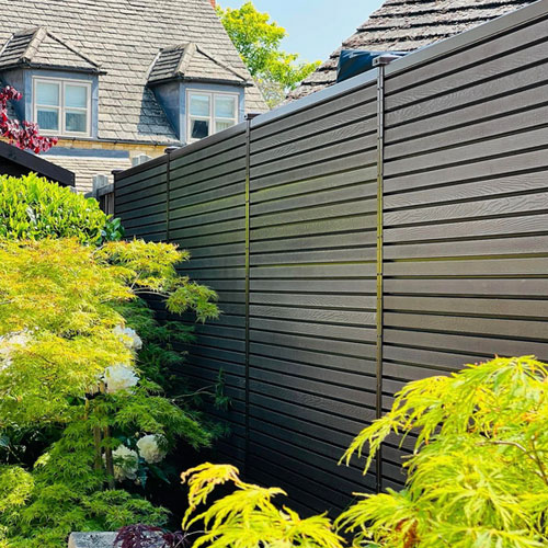 wooden fencing with gaps between slats of wood for air circulation