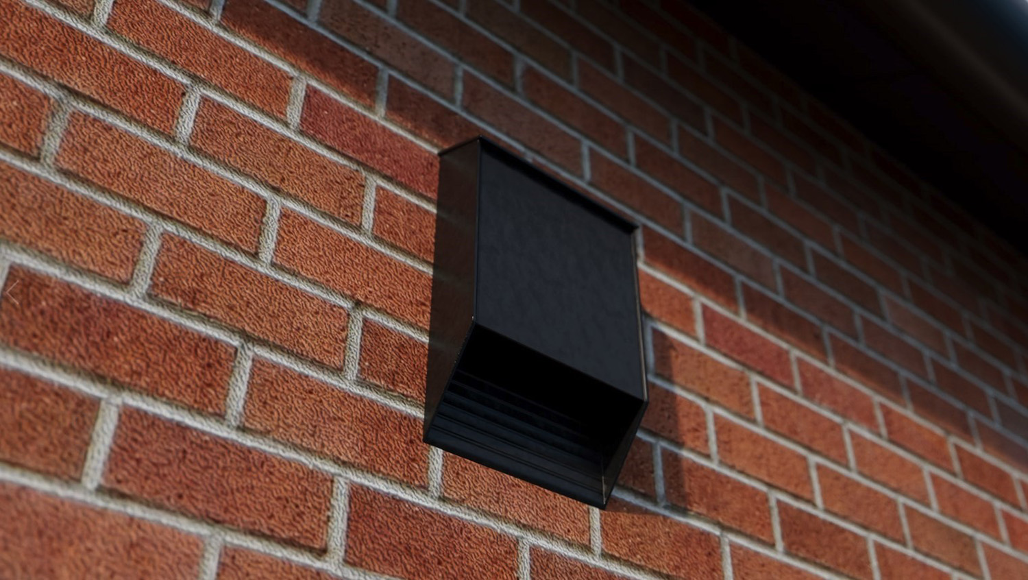 black box attached to wall with gap in the bottom for bats to nest in