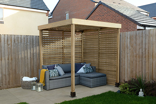 wooden fram attached to the ground whith grey outdoor sofa