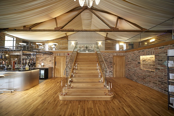 Oakwood staircase and flooring with lights and a bar