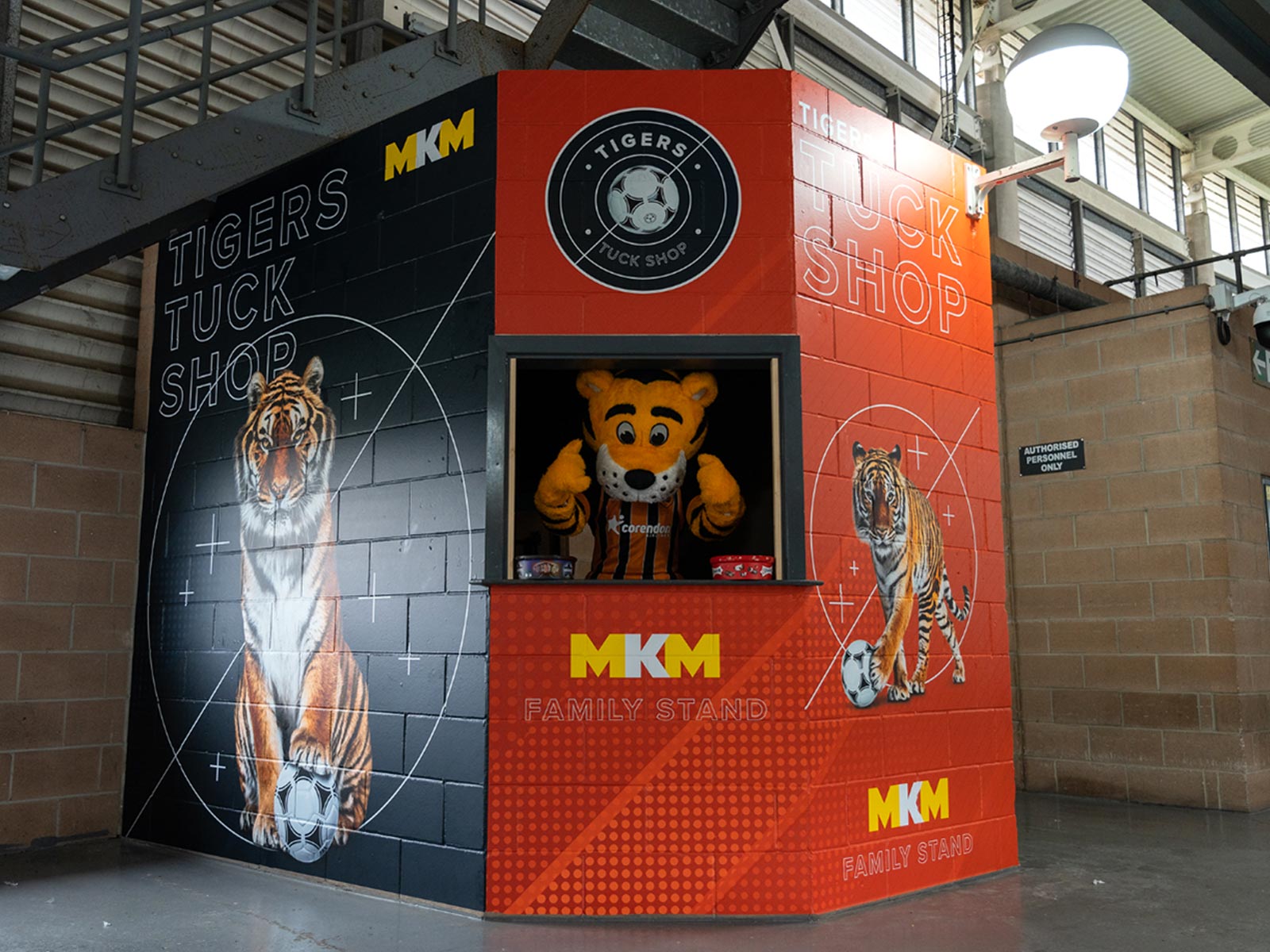 Tigers Tuck shop sponsored by MKM with mascot in small window