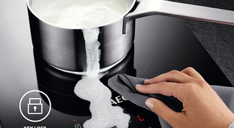 person cleaning touch screen of spillage without any damage done to it