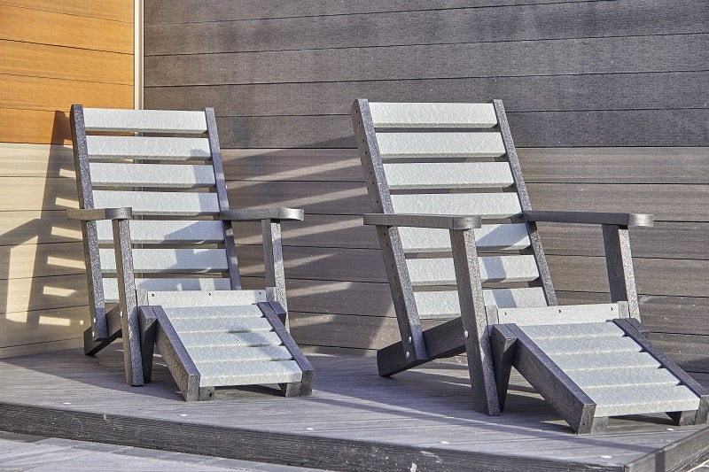 grey lounge chairs with foot rests