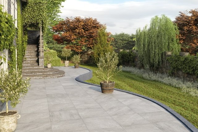 porcelain paving with plant ports containing sapplings, brick stairs and many trees